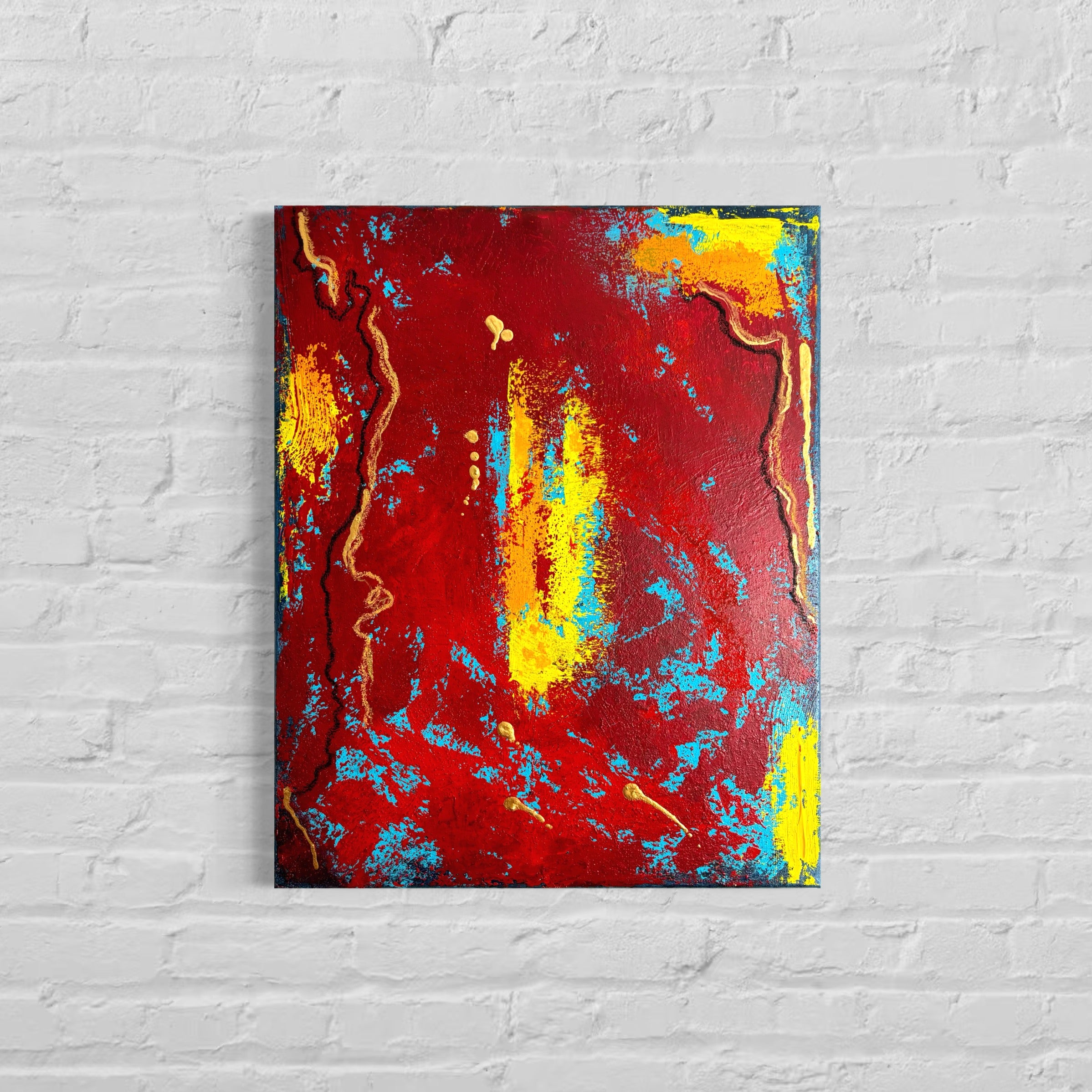 Abstract painting with red, yellow, and blue on a white brick wall