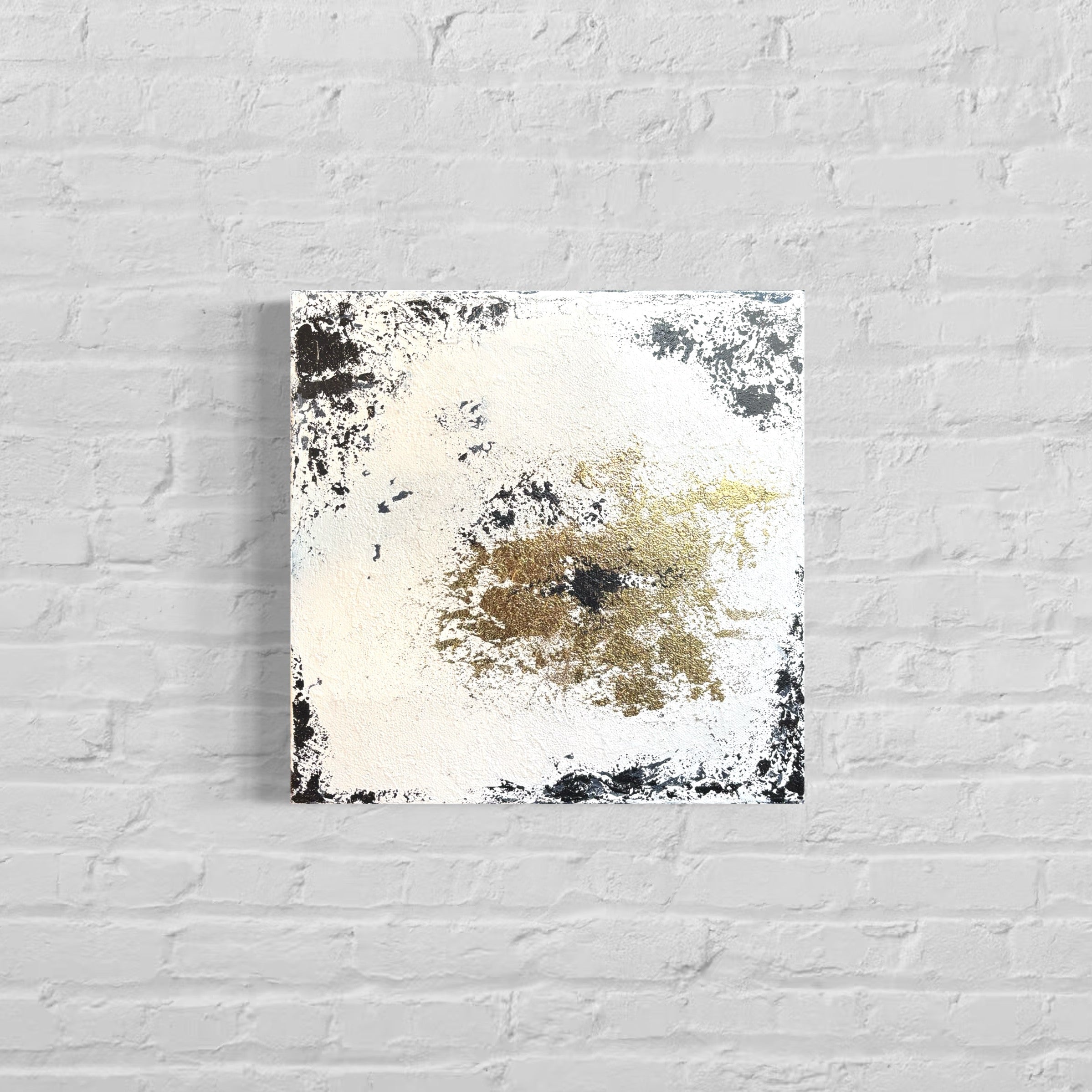 Abstract art piece on a white brick wall
