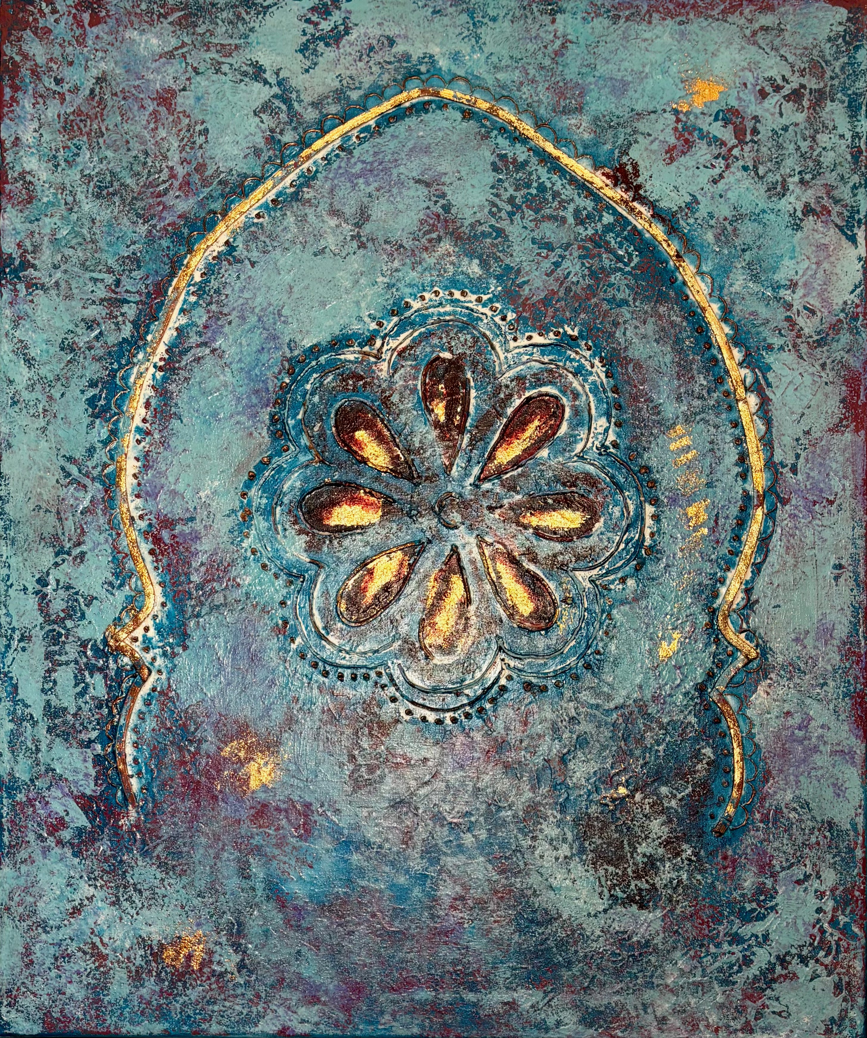 Decorative floral design with gold accents on a textured blue and purple background