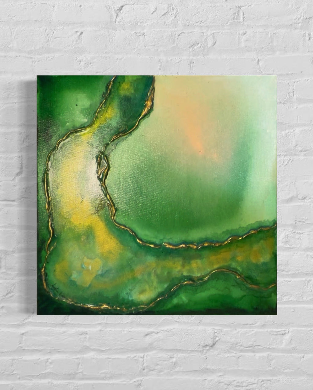 Abstract art piece with green and yellow colors on a white brick wall background