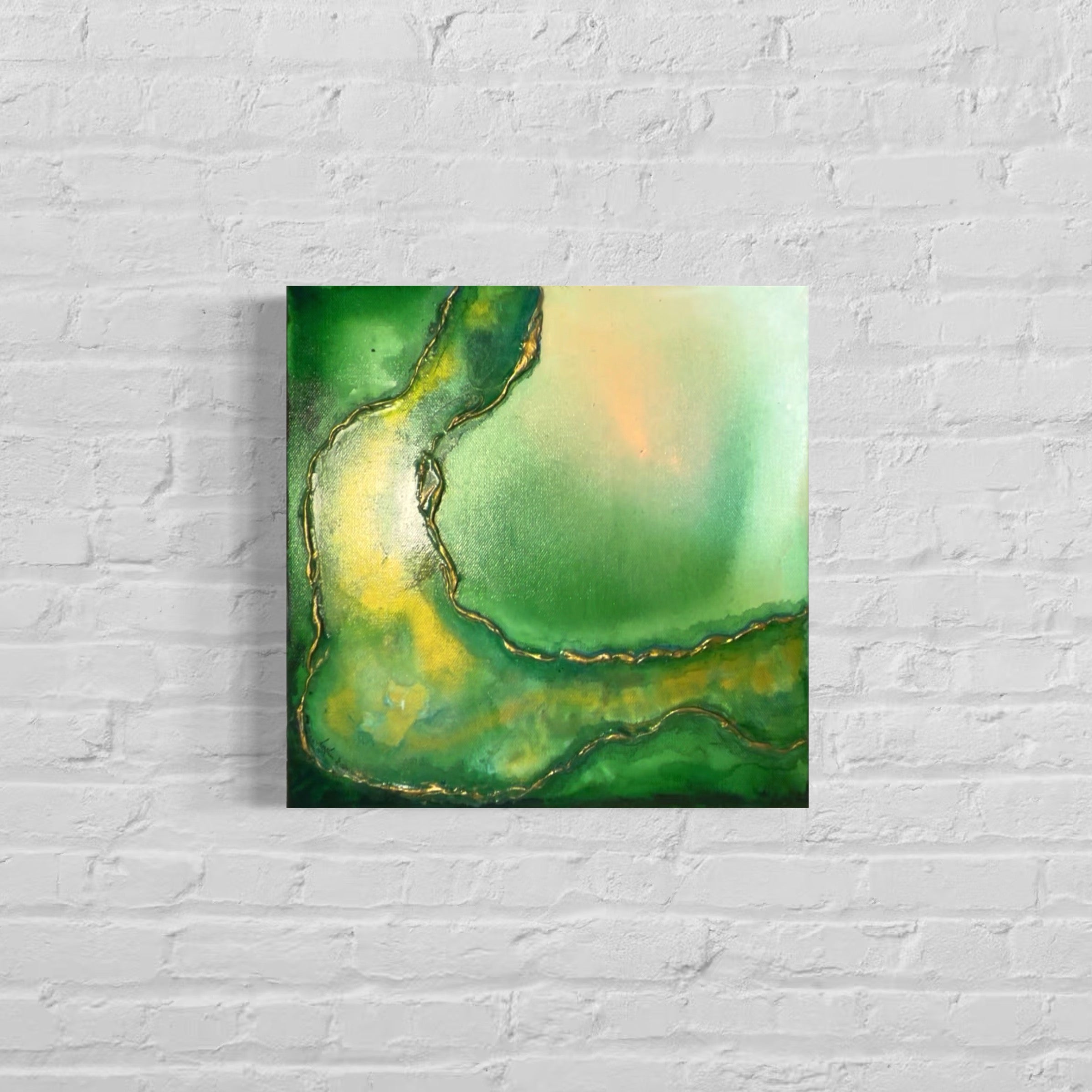 Abstract painting with green and yellow hues on a white brick wall