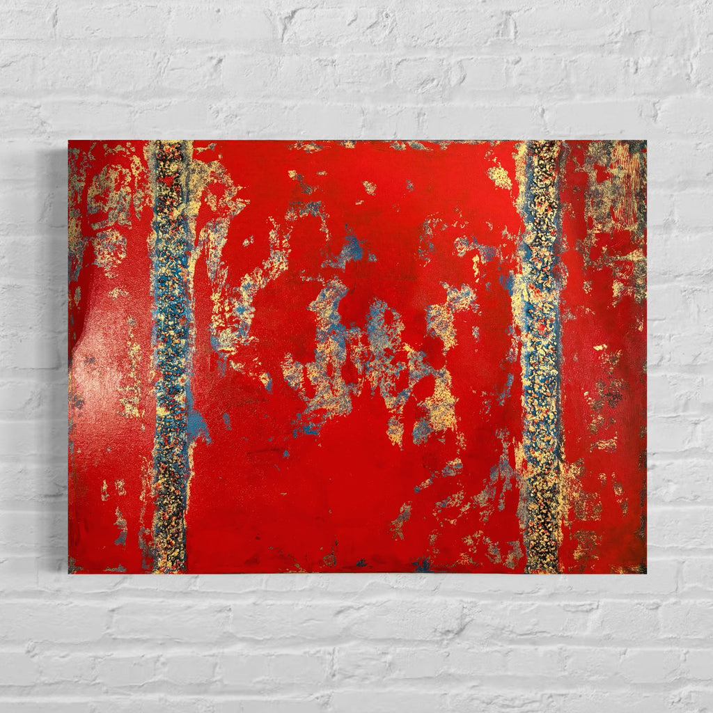 Abstract art piece with red and gold colors on a white brick wall background