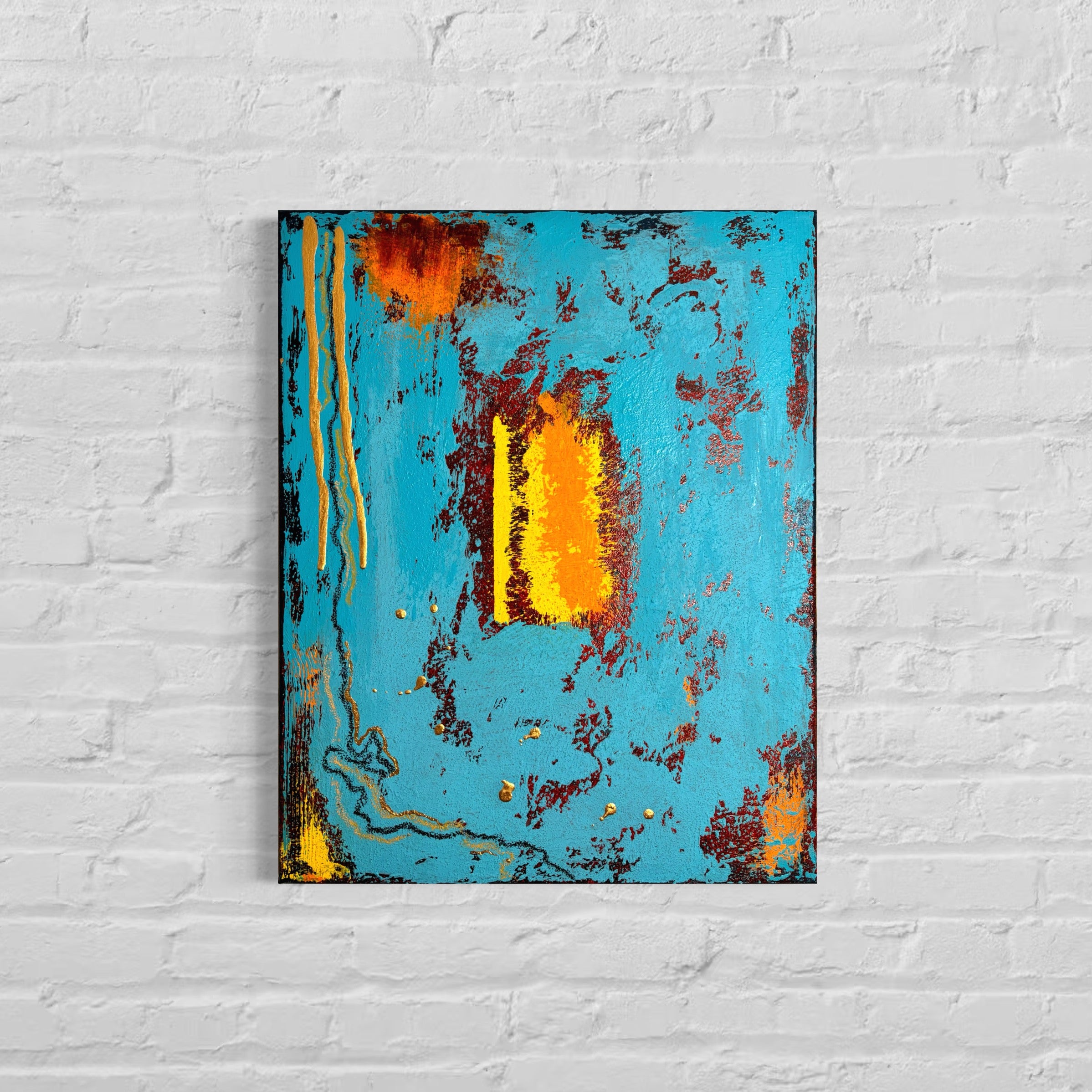 Abstract painting with blue, orange, and yellow on a white brick wall